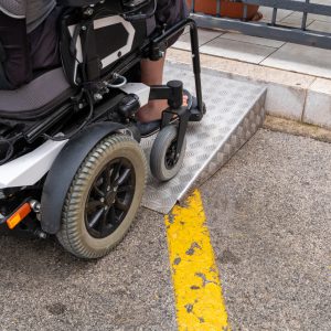 Ramp for disabled persons on wheelchair at building entrance.