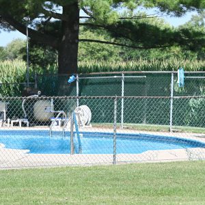 Swimming pool in the country by the cornfield.